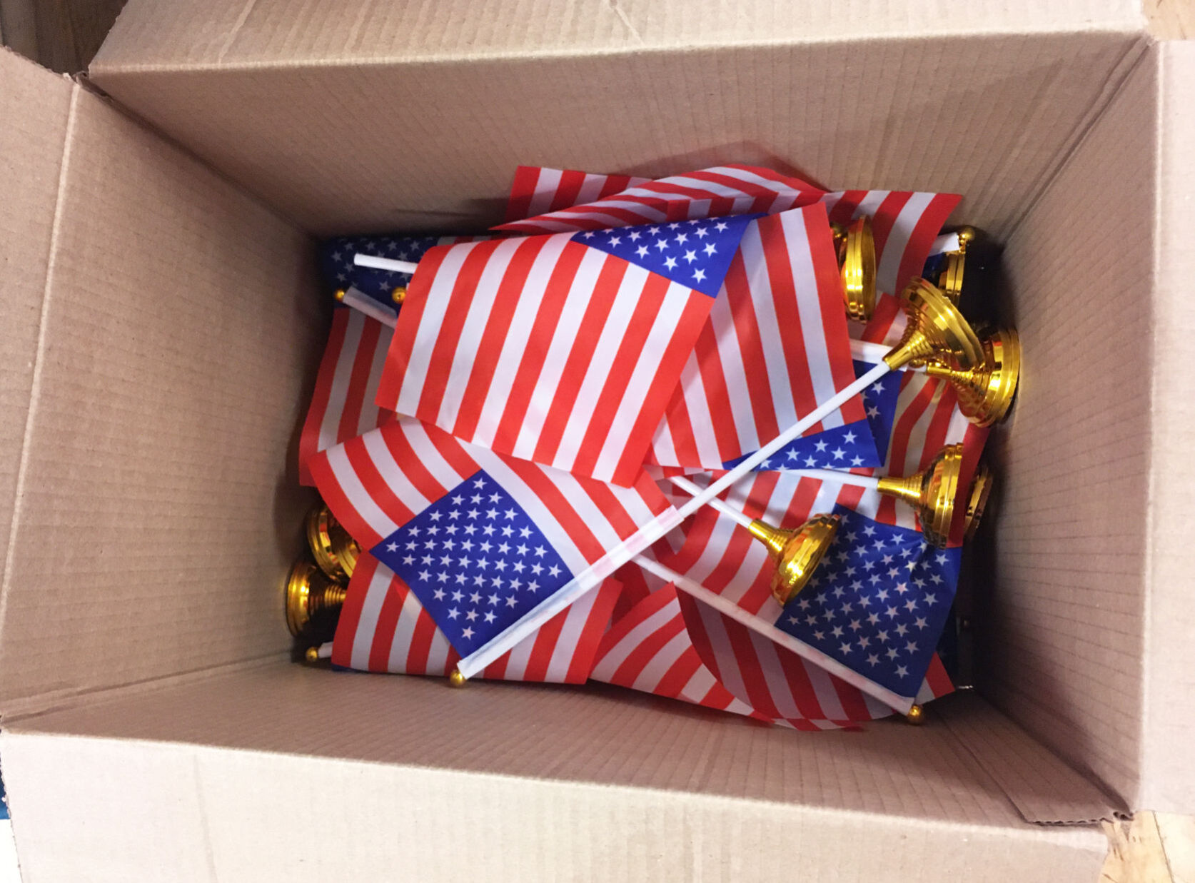 American flags in a box for distribution in holiday gifts going to veterans home